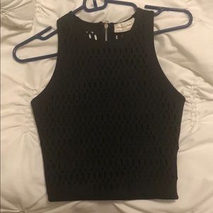 Black crop top with design in back. Very cute S